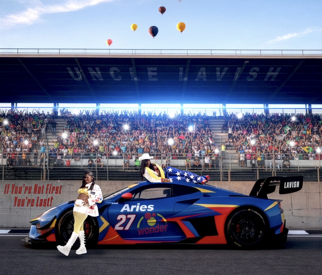 Race car with number 27 and driver in white suit, crowd in stands, balloons in sky, and a banner reading 'UNCLE MAVISH'.